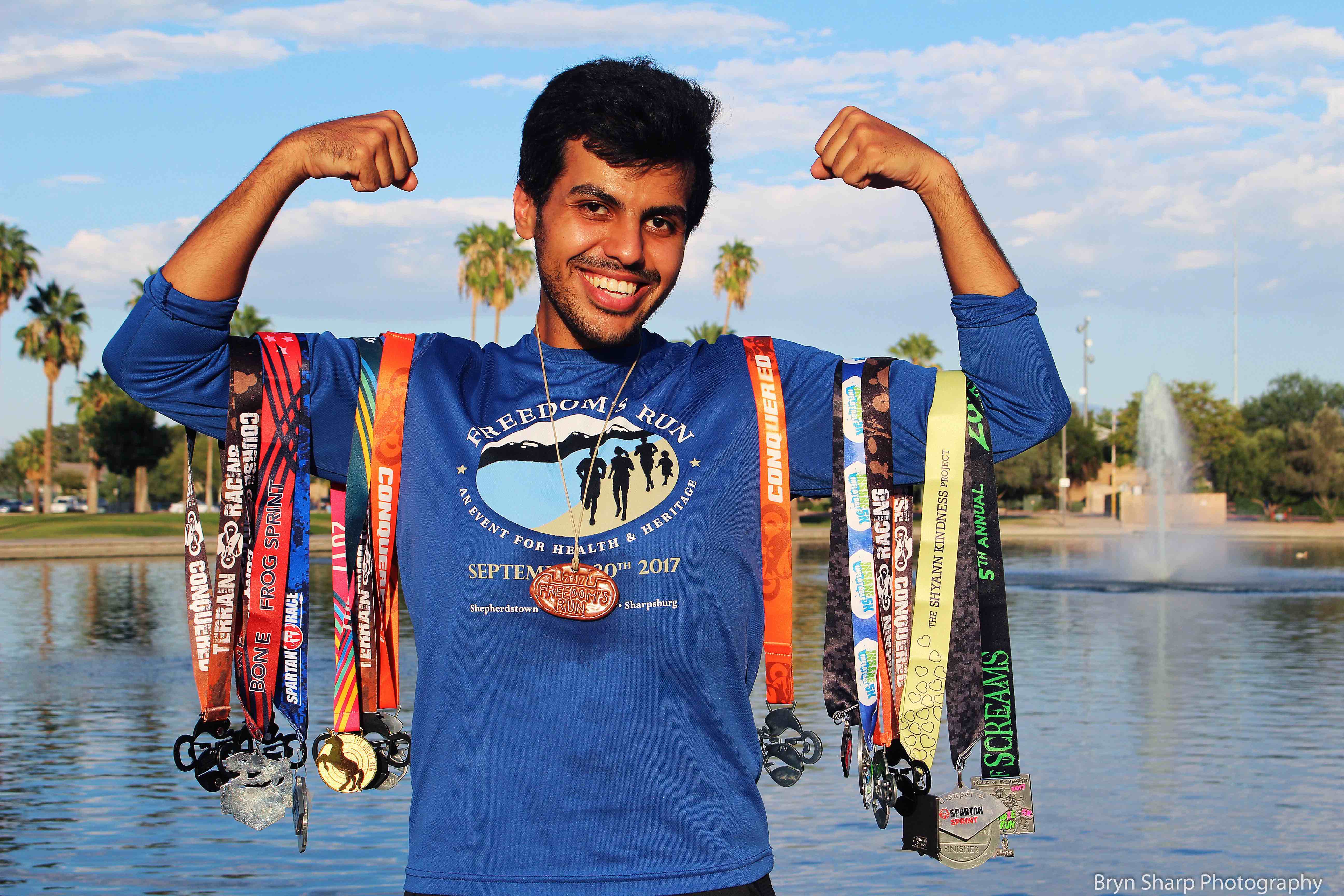 Ali with running races medals